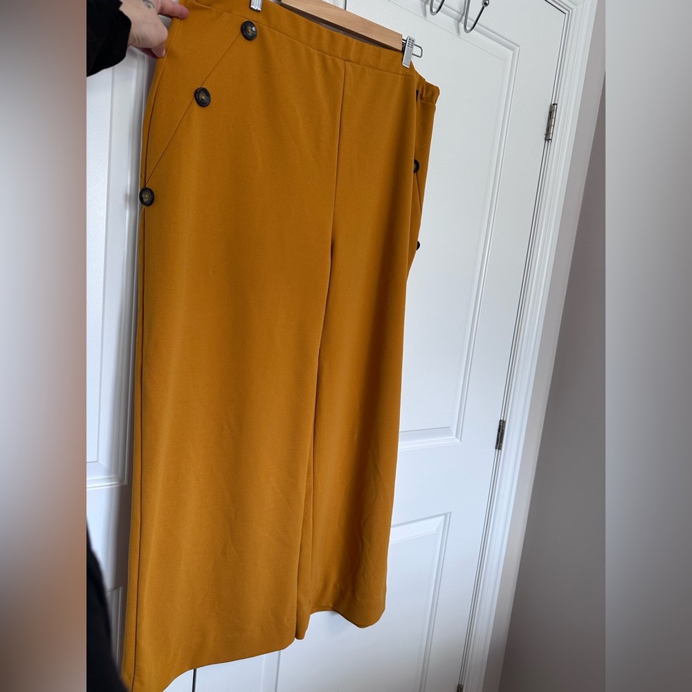 Mustard yellow wide leg dress pants with button detail